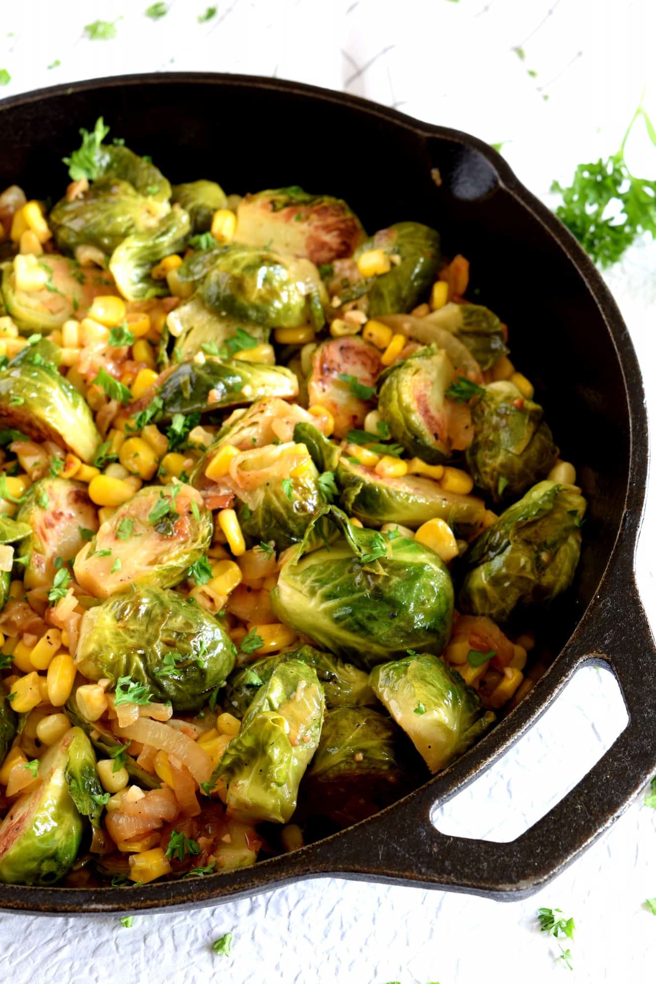 Spicy PanSeared Brussel Sprouts with Corn & Caramelized Onions