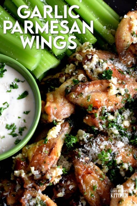 Chicken wings should be easy to prepare and taste great and those two simple rules are applied to these Garlic Parmesan Chicken Wings. With so much flavour, it's hard to believe that they are baked in an oven!  Tossed in a garlicky, cheesy, butter sauce, there never seems to be enough of these to please everyone! #garlic #garlicky #parmesan #cheese #chicken #wings #baked