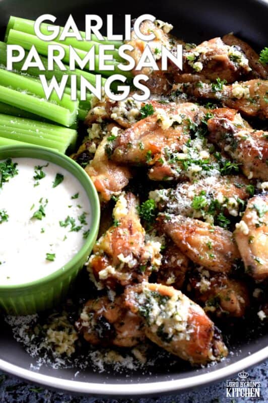 Chicken wings should be easy to prepare and taste great and those two simple rules are applied to these Garlic Parmesan Chicken Wings. With so much flavour, it's hard to believe that they are baked in an oven!  Tossed in a garlicky, cheesy, butter sauce, there never seems to be enough of these to please everyone! #garlic #garlicky #parmesan #cheese #chicken #wings #baked