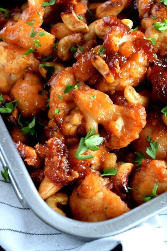 Cashew Cauliflower is the vegetarian equivalent of the classic Chinese buffet favourite, Cashew Chicken. The same great flavour as your favourite Chinese take out, but in vegetarian format.  This is one of those recipes that you will want to make over and over again. Yum! #cashew #cauliflower #takeout #vegetarian #asian