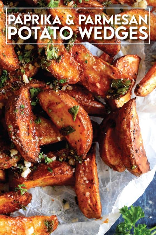 Roasted to perfection and perfectly seasoned, Paprika and Parmesan Potato Wedges are the perfect side dish - smoky, garlicky, onion-y, and cheesy - could these get any better? Oftentimes, these are served with finger foods like pizza or chicken wings. #potato #potatoes #wedges #wedge #fries #roasted #baked #cheese #parmesan