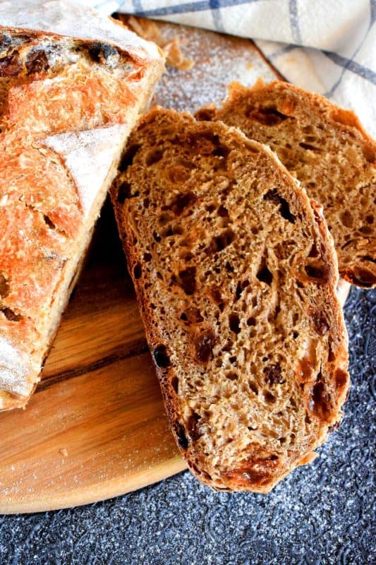 There's something really soothing and satisfying about freshly baked bread. Even more so when you bake that bread yourself! Dutch Oven Cinnamon Raisin Bread is the tastiest - and easiest! - bread you'll ever make. It's a good thing too, because you'll want to make this bread again and again! #dutchoven #cinnamon #raisin #cinnamonraisin #bread #homemadebread #dutchovenbread