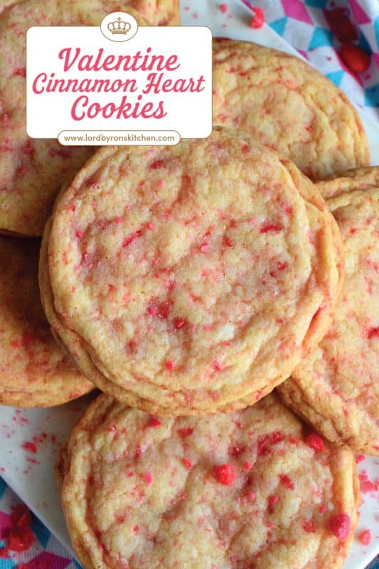Not all great cookies are soft and chewy. Valentine Cinnamon Heart Cookies are thin and crispy with a soft, sweet center. And, they're packed full of everyone's favourite cinnamon candy! Make a batch for your special someone today! #valentine #cinnamon #heart #candy #cookies