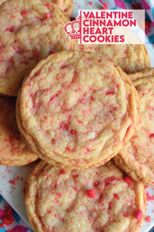Not all great cookies are soft and chewy. Valentine Cinnamon Heart Cookies are thin and crispy with a soft, sweet center. And, they're packed full of everyone's favourite cinnamon candy! Make a batch for your special someone today! #valentine #cinnamon #heart #candy #cookies