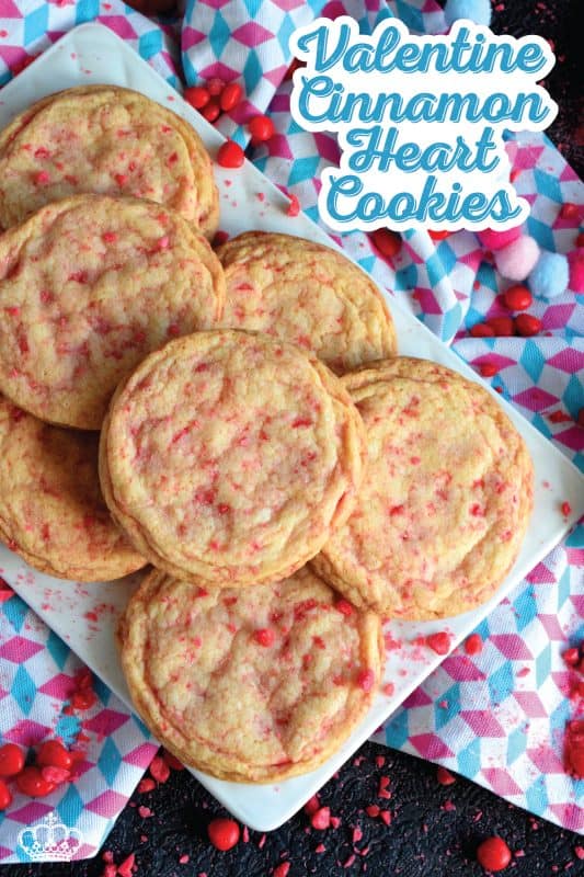 Not all great cookies are soft and chewy. Valentine Cinnamon Heart Cookies are thin and crispy with a soft, sweet center. And, they're packed full of everyone's favourite cinnamon candy! Make a batch for your special someone today! #valentine #cinnamon #heart #candy #cookies