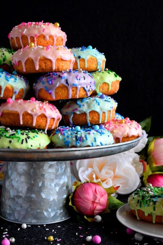 Who doesn't get excited when they see a big pile of donuts? Sure, you could go to your favourite pastry shop, but you can easily make your own donuts at home. This Stacked Donut Cake is proof of that! And, it's perfect for any occasion! #donuts #homemade #stackedcake #donutcake