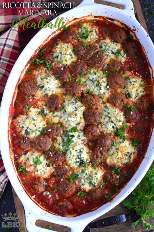 Your favourite meatballs baked in a ricotta and spinach marinara with herbs and parmesan - spoon over pasta for a delicious Sunday family supper!#ricotta #spinach #marinara #meatballs