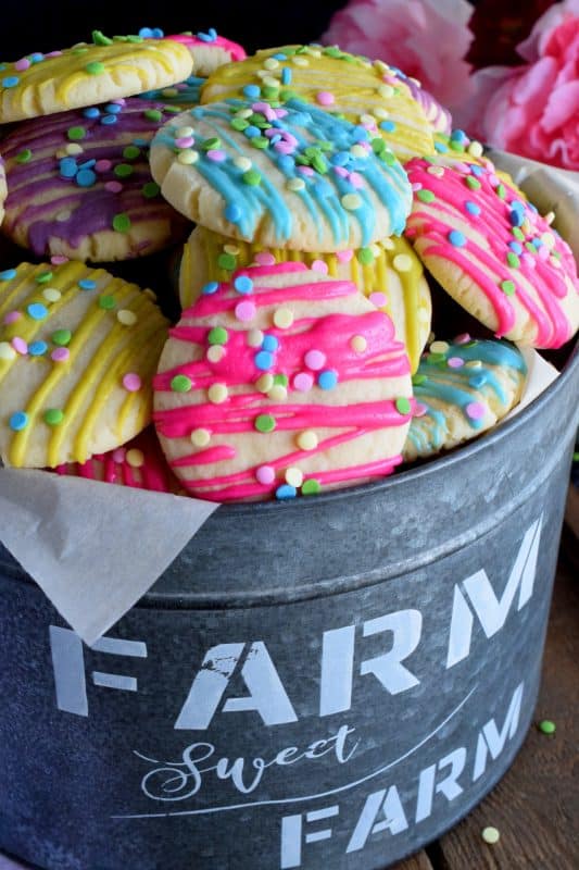 Whimsical and playful, these Easter Sugar Cookies are a springtime delight! Easy to prepare and fun to make, they are great for giving as a gift to that favourite teacher or daycare provider - that is if you can avoid saving them all for yourself! They are just a delicious as they are pretty! #easter #sugar #cookies #sugarcookies #candymelts