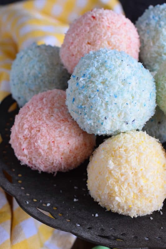 As tasty as they are pretty, Easter Bunny Coconut Tails are a no-bake, easy, kid-friendly recipe! They will love dying the coconut those pastel colours! #easter #bunny #balls #tail #cookies #pastel #nobake