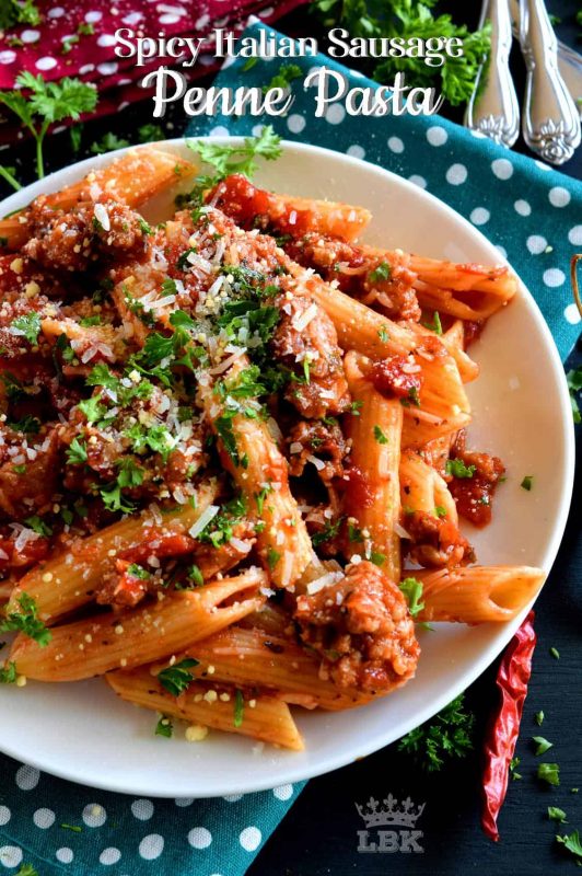 Prepare your next pasta dish with pork, like this Spicy Italian Sausage Penne Pasta dish, and reinvent pasta night!  A spicy tomato sauce, with peppers and onions, and lots of dried chilies, is simple and rustic, but so delicious!#penne #pasta #italian #sausage #spicy