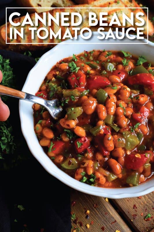 With the help of some fresh vegetables and a few herbs and spices from your pantry or spice rack, this Dressed Up Canned Beans in Tomato Sauce uses plain canned beans and transforms them so that they are extraordinarily flavourful and tastes homemade too! #beans #cannedbeans #homemade #sides