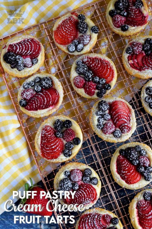 Turn store-bought puff pastry into delightful little tarts with fresh fruit and a lemony cream cheese filling; try eating just one!#puffpastry #berries #4thofjuly #recipes #summer #creamcheese #tarts #tartlets #fruit