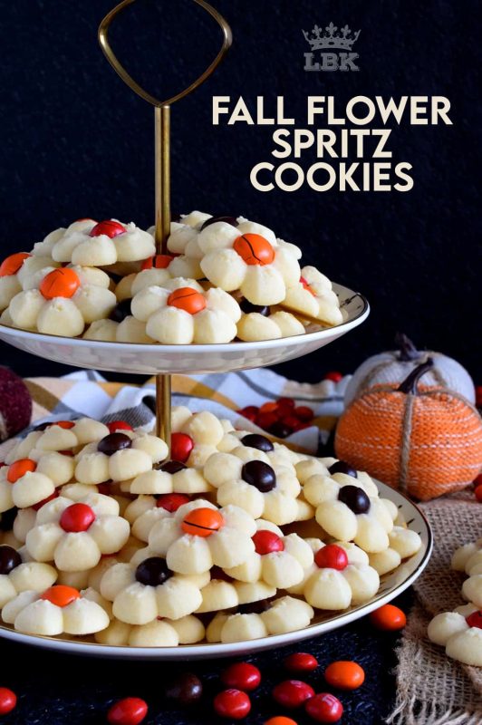 With the help of M&M candy and a cookie press, these spritz cookies look very much like a fall flower arrangement when piled high onto a serving plate. #thanksgiving #fall #cookies #press #spritz #M&Ms