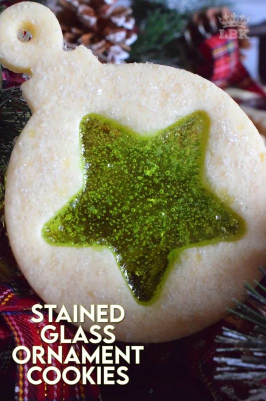 These beautiful Stained Glass Ornament Cookies are made with an easy rolled cookie dough, some glistening sanding sugar, and your favourite flavour of crushed Jolly Ranchers candy. #stainedglass #christmas #holiday #baking #cookies #edible #ornaments #cookiecutters