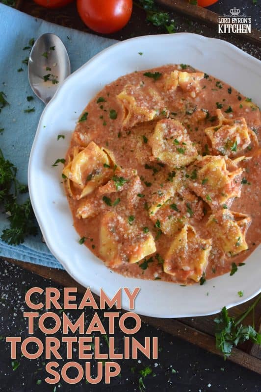 A quick and easy, hearty and cozy dinner, prepared with ready-made ingredients. Creamy Tomato Tortellini Soup is made with canned tomato soup, frozen pasta, and cream cheese. It is the ultimate cold-weather, family-friendly meal! #creamy #tortellini #tomatosoup #soupwithpasta #creamcheese #familyrecipes #meatlessmonday