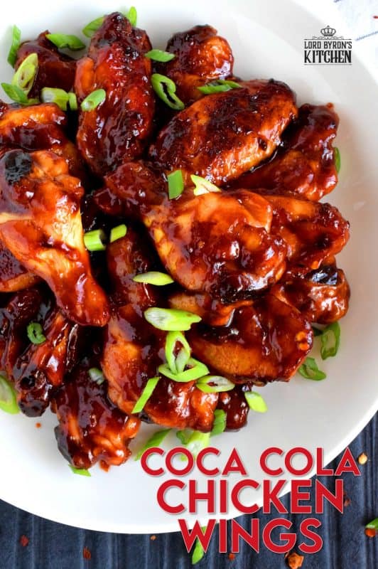 A can of Coke helps to sweeten and thicken this gorgeous and delicious sauce. Coca Cola Chicken Wings are the ultimate sticky, finger-licking, game-time appetizer.  Who am I kidding!? These are perfect any time you choose to eat them - game or not! #coke #cocacola #cola #chicken #wings #gametime #appetizer