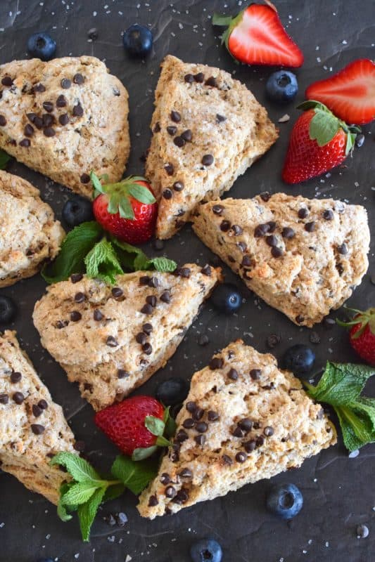 A scone for both the little kids in your life, and the adults that live their lives like a kid, Chocolate Chip Scones are sweeter than regular scones. With a good splash of vanilla, loads of milk chocolate chips, and a sprinkling of coarse sugar on top, these scones are an absolute treat. #scones #chocolate #chocolatechips