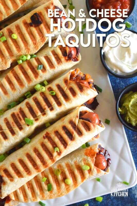 If you cannot decide whether you want a hot dog, a burrito, or a taquito for dinner, then you should just have all three in one! Bean and Cheese Hotdog Taquitos are prepared by rolling a tortilla with refried black beans, shredded cheese, and a hotdog. Grill until golden and crispy. Serve with your favourite dippers! #bbq #bean #cheese #hotdog #taquitos