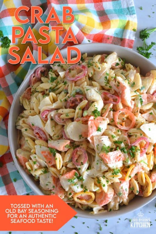 Flaked crab is paired with pasta and peppers in this Crab Pasta Salad. It is tossed in a creamy and tangy dressing made with mayonnaise, old bay seasoning, celery salt, and more. A great make-ahead salad best served slightly chilled with your favourite grilled beef! It's surf and turf - summer style! #pastasalad #salad #pasta #seafood #crab #imitationcrab