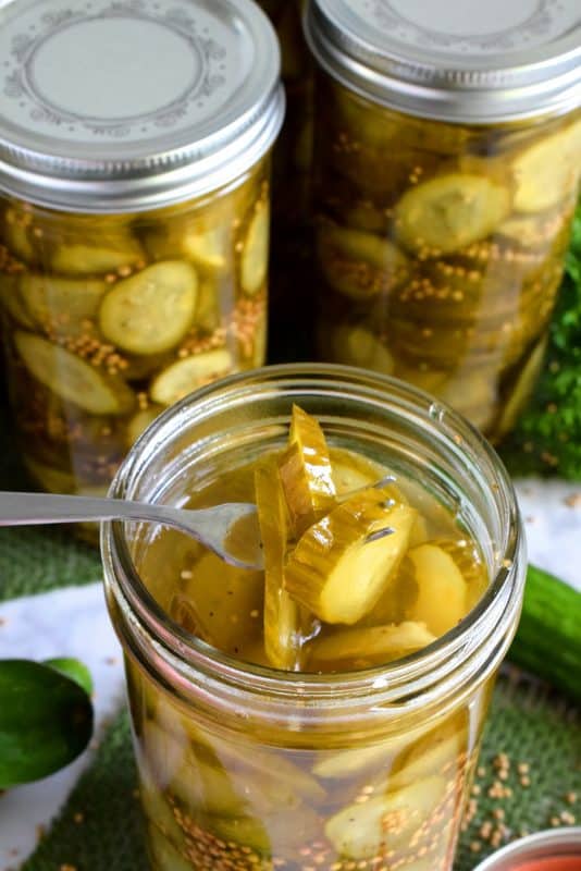 Every sandwich needs a pickle! Preserve your own Sweet Sandwich Pickles using a water bath canning method - easy and inexpensive too! Both zucchini and cucumbers will work in this recipe! #pickles #canned #sweet #preserves