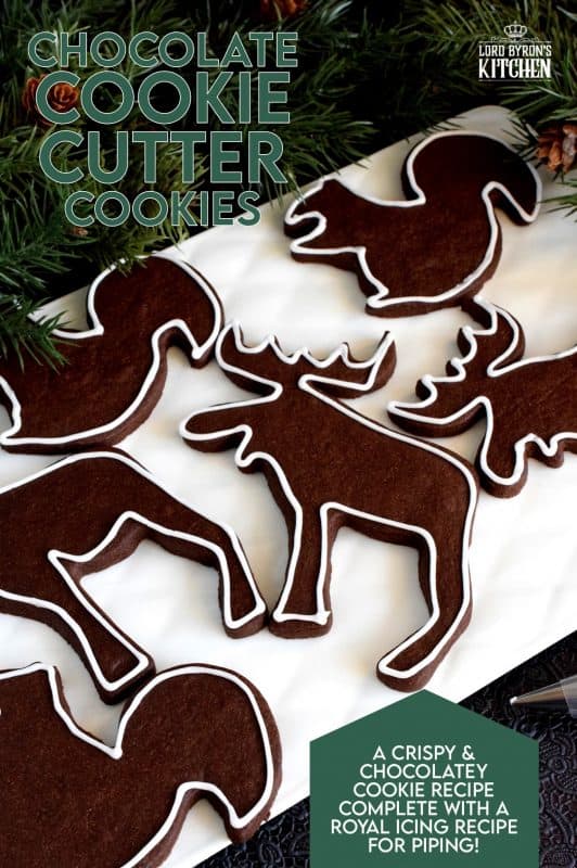 Christmastime is synonymous with cookie cutter cookies.  Crispy Chocolate Cookie Cutter Cookies are a simple and inexpensive way to add a special touch to a deliciously classic cookie. Besides, who doesn't love playing with cookie cutters and icing at Christmastime!? #christmas #holiday #baking #chocolate #cookie #cutter #cookies