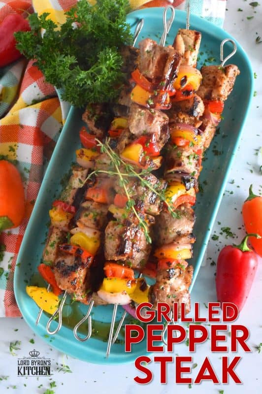 Marinated and skewered, Grilled Pepper Steak is simple, yet so delicious! The marinade tenderizes the steak while the peppers and red onions help to flavour it. Perfectly prepared to medium-well in about twelve minutes! #steak #bbq #kebabs #skewers #beef #summergrilling #grilled