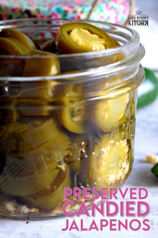 Preserved Candied Jalapenos are bite-sized morsels of heat and sweet - these are highly addictive, easy to prepare, and no canning experience is needed. Makes for a great bring-along gift too! #jalapenos #pickled #preserved #waterbath #canning