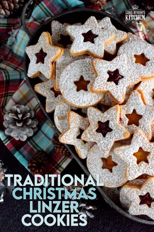 Christmas is all about tradition, both the new traditions and the old.  This Traditional Christmas Linzer Cookies recipe, an old world cookie confection, originating in Austria, is a vital part of holiday traditions for many families. Also, they look impressive, but they are so simple to make! #linzer #traditional #christmas #holiday #baking #cookies