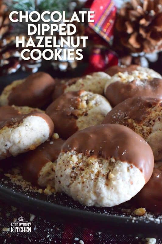 Ground hazelnuts, butter, sugar, and chocolate - what more is there to say? Chocolate Dipped Hazelnut Cookies have deep nutty flavour, a great texture, and bit of indulgence. One batch will never do! #chocolatedipped #hazenut #nut #chocolate #cookies #christmas #holiday #baking