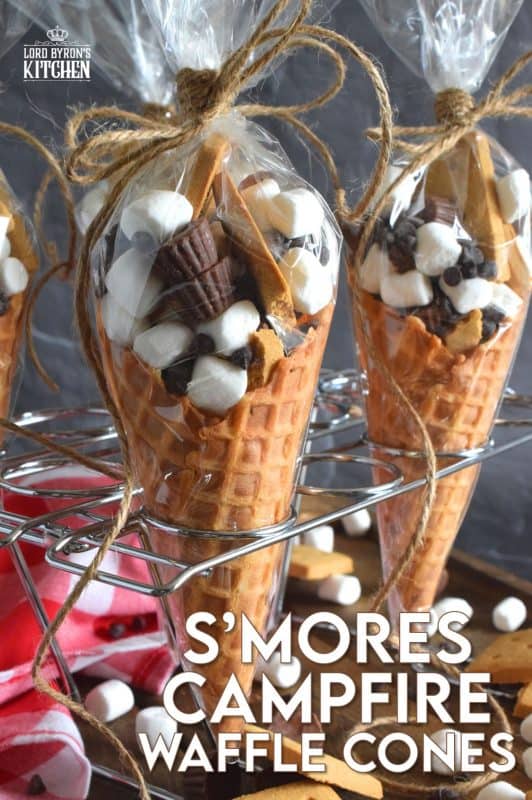 Prepare a bunch of these S'mores Campfire Waffle Cones and wrap them in aluminum foil. Set them onto a grilling rack over the fire for a few minutes and they will be all melty and gooey on the inside, but contained within the cone. No more sticky fingers! Serve the cones with a spoon and enjoy! #campfire #smores #wafflecones #marshmallow