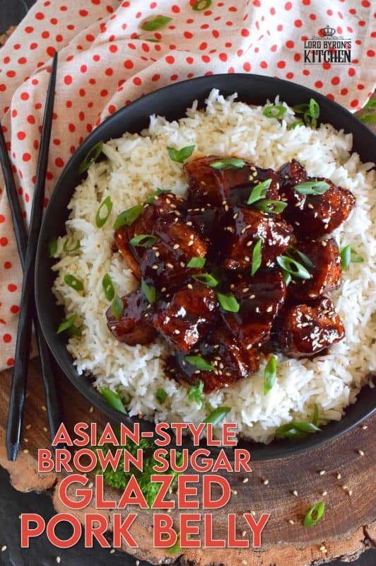 This sweet and sticky Glazed Pork Belly is cooked in two stages. First, the meat is boiled with seasonings and then fried before being cooked in a brown sugar, soy sauce, and rice wine reduction. Served with steamed rice, this is a meal that would please the toughest critic! #porkbelly #asiancooking #pork #glazed #homemade #takeout #porkrecipes