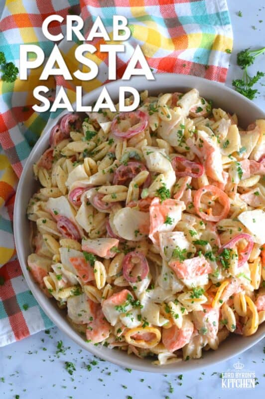 Flaked crab is paired with pasta and peppers in this Crab Pasta Salad. It is tossed in a creamy and tangy dressing made with mayonnaise, old bay seasoning, celery salt, and more. A great make-ahead salad best served slightly chilled with your favourite grilled beef! It's surf and turf - summer style! #crab #pasta #salad #imitation