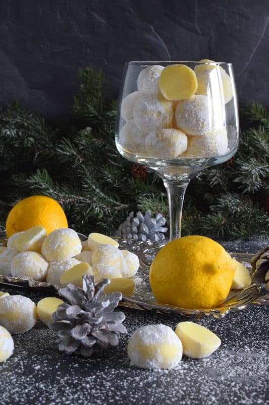 If you love lemon, White Chocolate Limoncello Truffles will make you a very happy person! Prepared with white chocolate, lemon zest, and limoncello liqueur, these truffles are perfectly sweet and sour. These pale yellow delights will melt in your mouth! #christmas #whitechocolate #holiday #nobake #truffles #limoncello #boozy