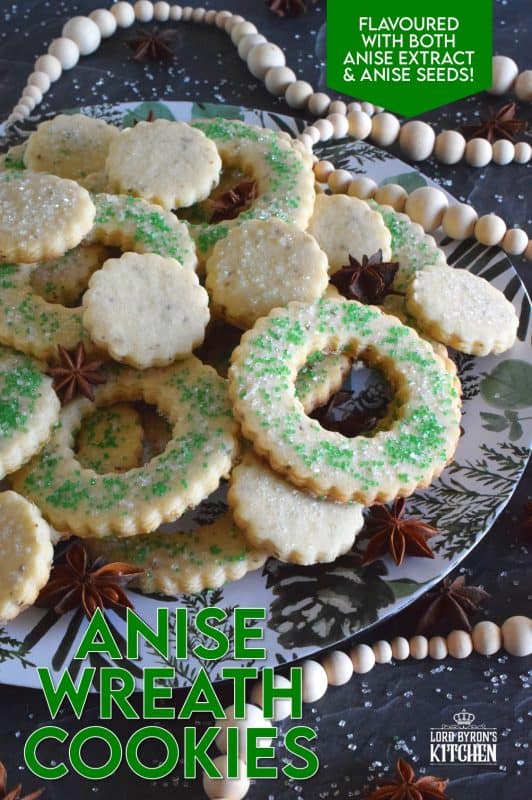 These tender, flaky, yet crisp Anise Wreath Cookies are prepared with a basic rolled cookie dough, but flavoured with crushed anise seeds. Sprinkled with green sanding sugar, these licorice-flavoured cookies are a great addition to any holiday cookie exchange or cookie platter! #christmas #holiday #baking #cookies #wreath #anise #aniseed