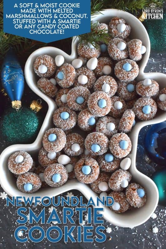 Prepared with melted marshmallows, cocoa, and graham crumbs, Newfoundland Smartie Cookies are sure to give you smores vibes. The addition of the candy coated chocolate in the center helps to make this cookie feel and look more festive. #smarties #newfoundland #christmas #nobake #cookies #newfie