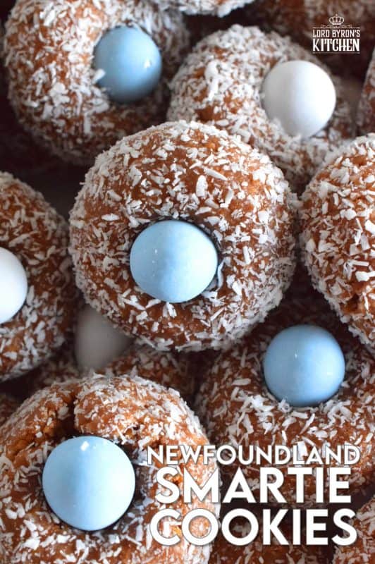 Prepared with melted marshmallows, cocoa, and graham crumbs, Newfoundland Smartie Cookies are sure to give you smores vibes. The addition of the candy coated chocolate in the center helps to make this cookie feel and look more festive. #smarties #newfoundland #christmas #nobake #cookies #newfie