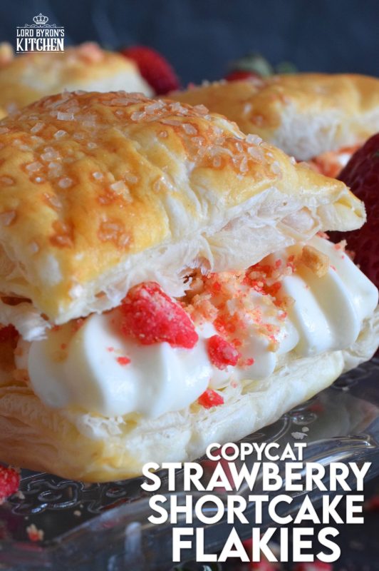 A deliciously creamy and sweet frosting is layered between a flaky and crispy puff pastry with strawberry shortcake crumbs and homemade strawberry jam. Copycat Strawberry Shortcake Flakies just might be better than the original store-bought version! Give them a try! #flakies #passionflakies #copycatrecipes #strawberryshortcake #strawberry #valentine #desserts