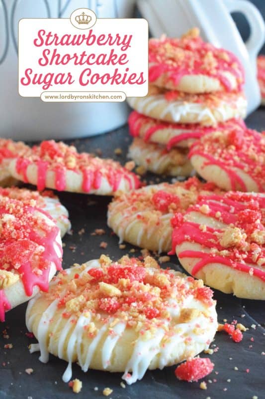 The uncomplicated and delicious sugar cookie gets a fresh, new flavour profile, and an upgrade in this Strawberry Shortcake Sugar Cookies recipe. A classic sugar cookie base is topped with a simple glaze and sprinkled with homemade shortcake crumbs. These would make a great giftable dessert idea for Valentine's Day! #sugarcookies #cookies #valentines #strawberry #shortcake
