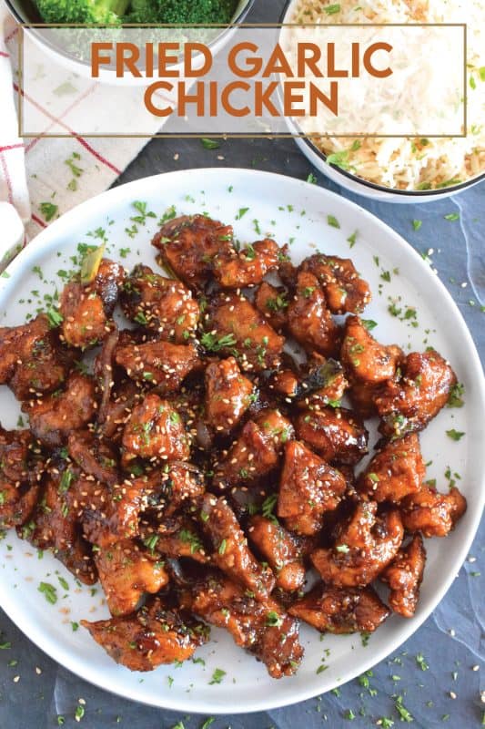 Fried Garlic Chicken is a crispy fried chicken in a thick and savoury garlic sauce; this dish is most certainly for the garlic lover. Prepared with a unique battering technique, and double fried, this chicken is sweet and super garlicky - it's made with twelve cloves of garlic! #garliclovers #garlicky #friedchicken #chicken #thighs