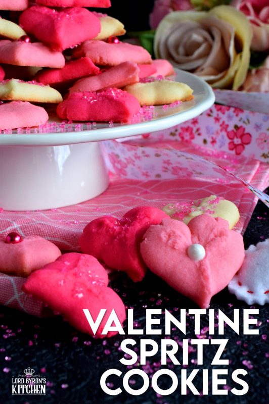Valentine Spritz Cookies are bright, cheerful, and will bring a smile to anyone's face. These are so easy to make and so delicious too! Break out your sprinkles and have some fun!! #valentinebaking #valentinecookies #pinkrecipes #spritzcookies #cookies #valentinetreats