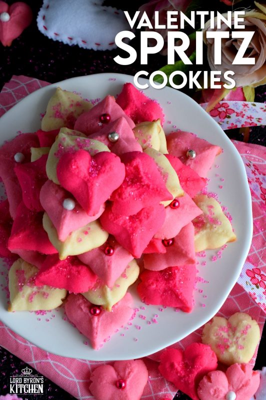 Valentine Spritz Cookies are bright, cheerful, and will bring a smile to anyone's face. These are so easy to make and so delicious too! Break out your sprinkles and have some fun!! #valentinebaking #valentinecookies #pinkrecipes #spritzcookies #cookies #valentinetreats