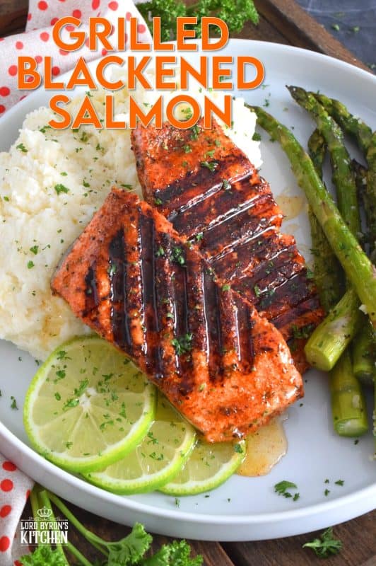 Salmon fillets are liberally dusted with an easy to make homemade blackening seasoning and grilled over high heat to get those prominent grill marks. Once plated, the salmon is drizzled with an optional spiced honey lime sauce. Simple and easy, yet gorgeous and delicious, this is not your average salmon dinner! #blackened #salmon #grilledsalmon #grillingrecipes #30minutemeals
