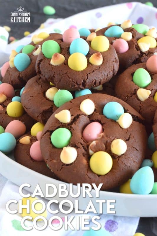 Cadbury Chocolate Cookies are slightly crispy on the outside, with a moist and dense chocolaty center. Stuffed with white chocolate chips and topped with chocolate mini eggs, these are substantial cookies, meaning that they are thick and filling. Great for dunking in a glass of cold milk too!  #cadbury #minieggs #easter #cookies #chocolate