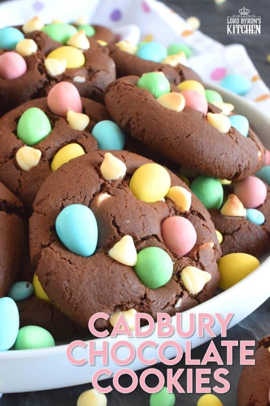 Cadbury Chocolate Cookies are slightly crispy on the outside, with a moist and dense chocolaty center. Stuffed with white chocolate chips and topped with chocolate mini eggs, these are substantial cookies, meaning that they are thick and filling. Great for dunking in a glass of cold milk too!  #cadbury #minieggs #easter #cookies #chocolate