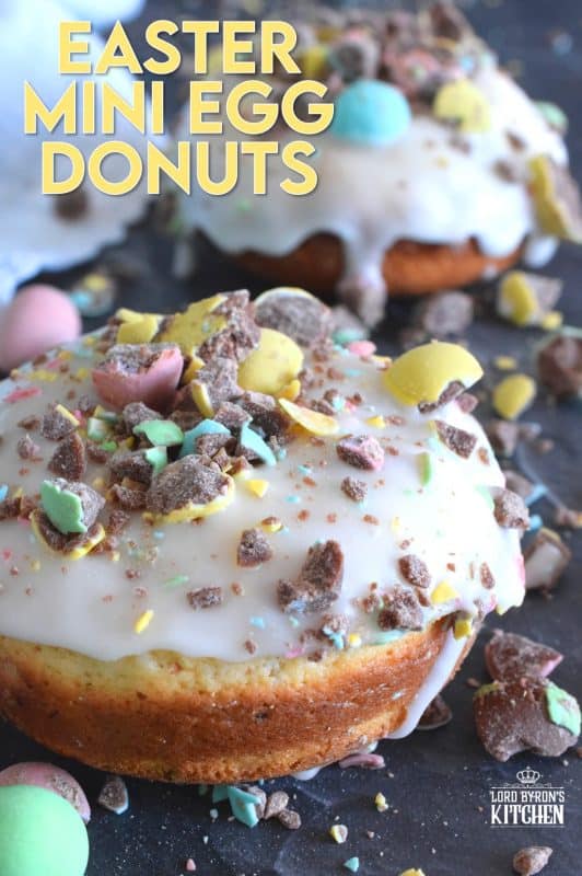 When it comes to donuts, chocolate is always a great choice. Easter Mini Egg Donuts are prepared with a vanilla batter, loaded with crushed Cadbury mini eggs, topped with a simple sugar glaze, and more crushed mini eggs! Easter treats never tasted so good! #donuts #bakeddonuts #doughnuts #easter #cadbury #minieggs