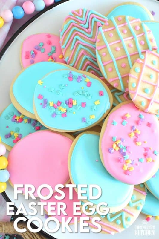 Frosted Easter Egg Cookies are prepared with a light and airy shortbread cookie base consisting of only three ingredients! Once cooled, they are frosted with an easy to make royal icing, which hardens and crisps when dried. Topped with sprinkles or simply frosted with whimsical patterns, it's hard to eat only one of these cookies! #easter #easteregg #cookies #royalicing #frosted #sprinkles #cookiecutter