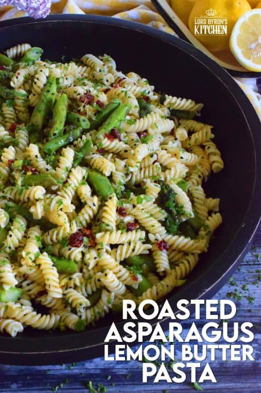 A dish that can only be described as springtime in a bowl, this simple butter roasted asparagus pasta salad, tossed with sun dried tomatoes, fresh lemon, and parmesan. A delightful cold pasta salad that everyone will love! #asparagus #lemon #butter #pasta #salad
