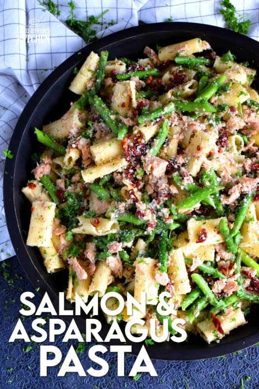 Served warm or hot, Salmon and Asparagus Pasta Salad is a complete meal with so much flavour and texture! The fresh asparagus, lemon juice, and freshly grated parmesan cheese come together to elevate the inexpensive and humble canned flaked salmon! #canned #salmon #asparagus #salad #costco
