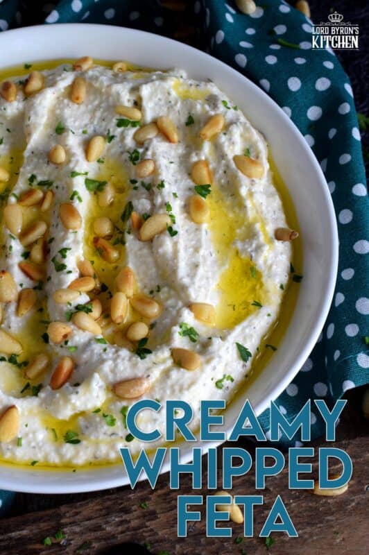 Salty and velvety smooth, seasoned with pantry herbs and spices, Creamy Whipped Feta will satisfy all of your snack cravings. Smear it on crackers and bread, or use it as a dip with veggies or pita.  For even more flavour, be sure to toast the pine nuts first! #feta #fetadip #whippedfeta #dip #spread #appetizer
