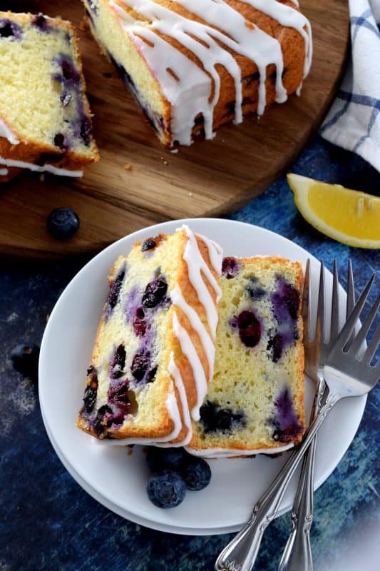 Moist and delicious, lemony and refreshing, packed with blueberries, and drizzled with a sweet, lemon glaze, my Lemon Glazed Blueberry Loaf is a perfect dessert or a lovely addition to your afternoon tea. #blueberry #lemon #lemonloaf #blueberries #blueberrybread #glaze #glazedloaf
